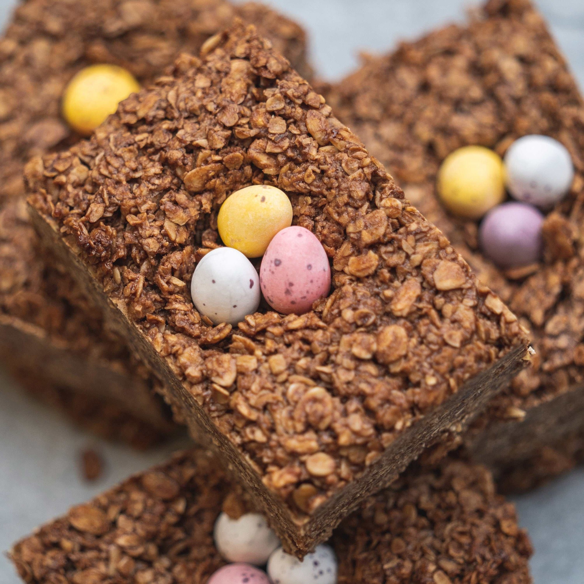 Oatopia artisan flapjacks with colorful Easter eggs, Sussex bakery Easter treat