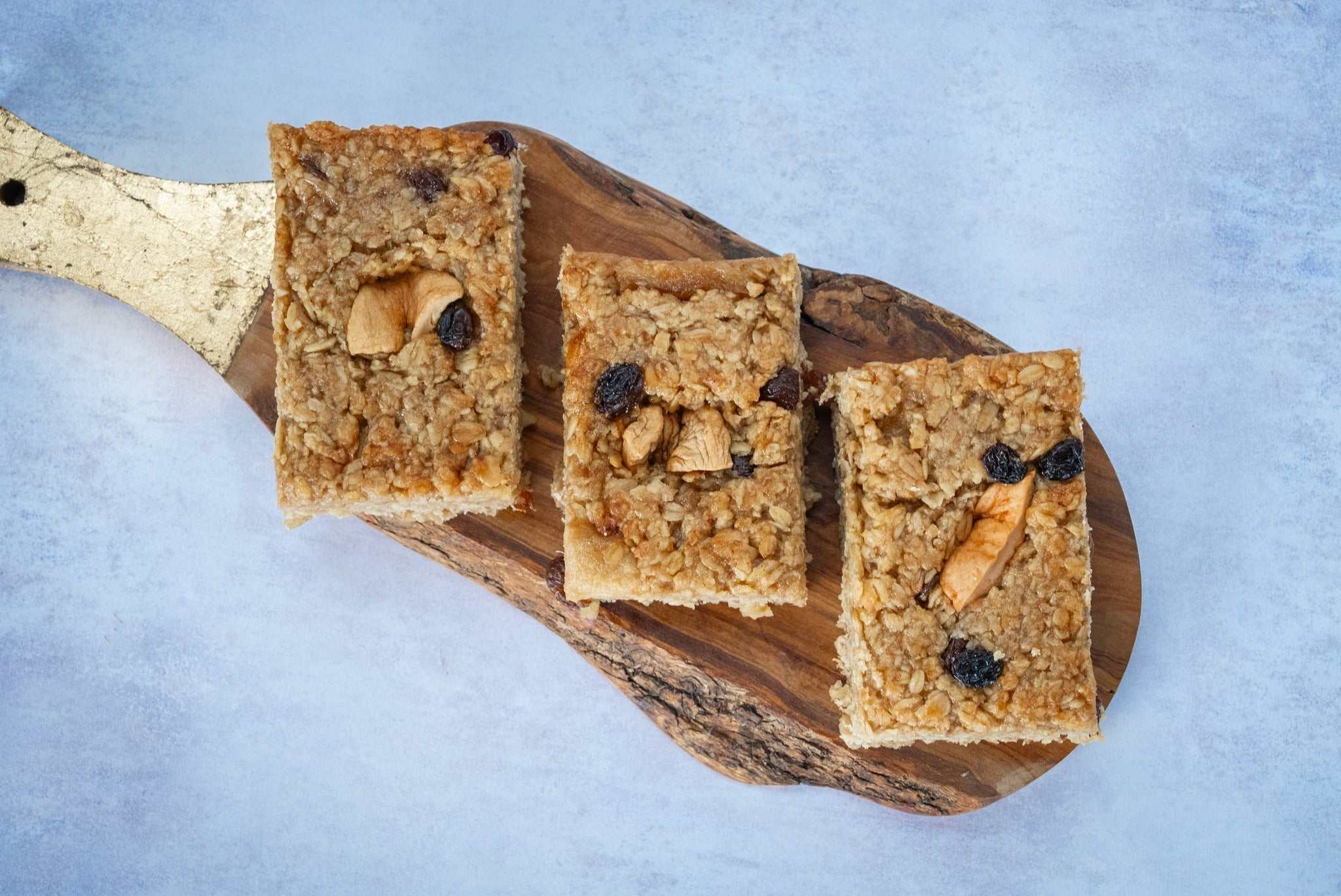 Apple Cinnamon & Raisin Flapjack with dried apple ring on top, handmade oat bake with cinnamon and raisins