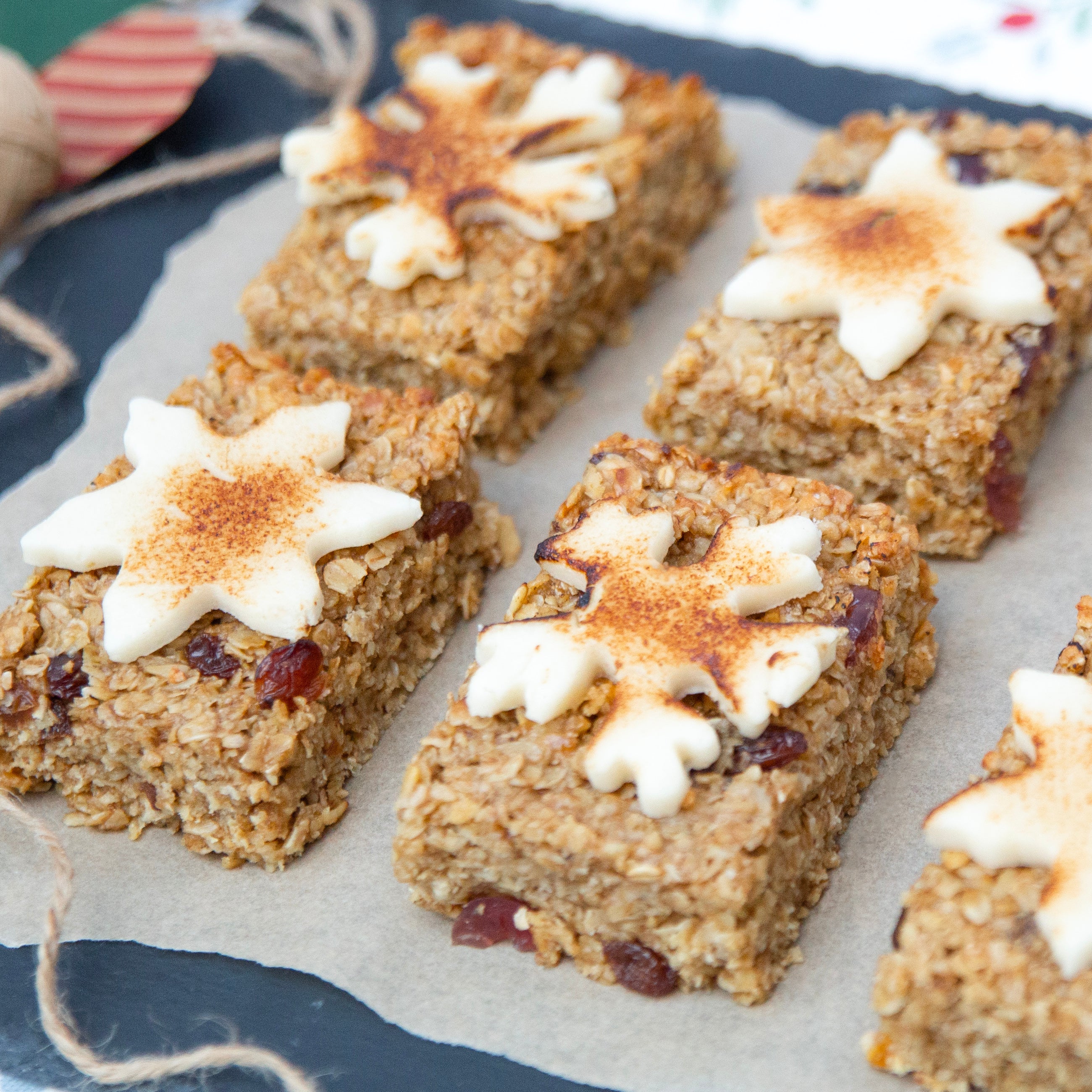 Oatmeal bars with white frosting and cinnamon on a blue plate