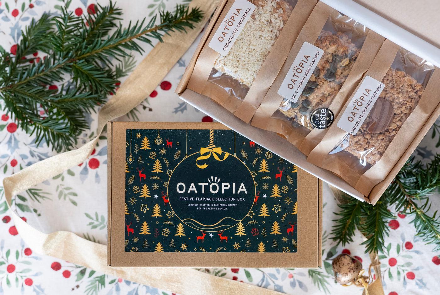 Oatopia festive flaxseed selection box with packaging on a decorative background