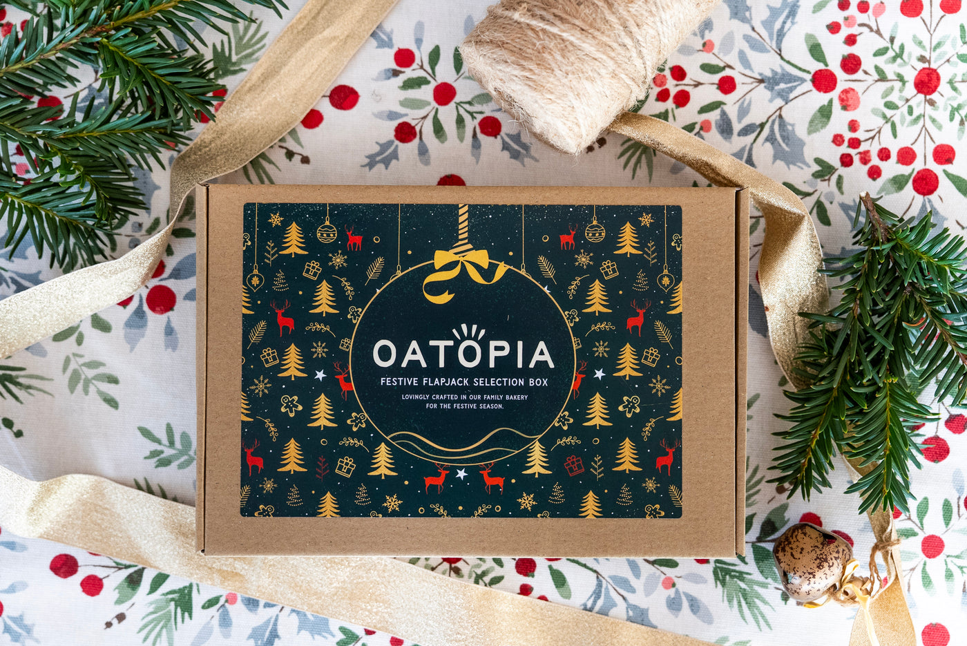 Oatopia festive gift box with Christmas-themed design on a decorative background