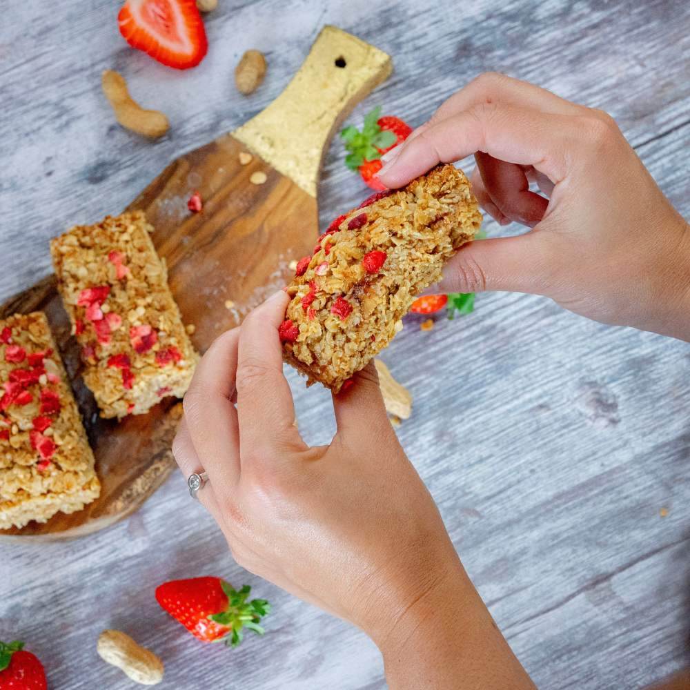 Peanut Butter & Jam Flapjack with strawberry jam, peanut butter, and roasted peanuts on soft baked oat base, World Cup special treat