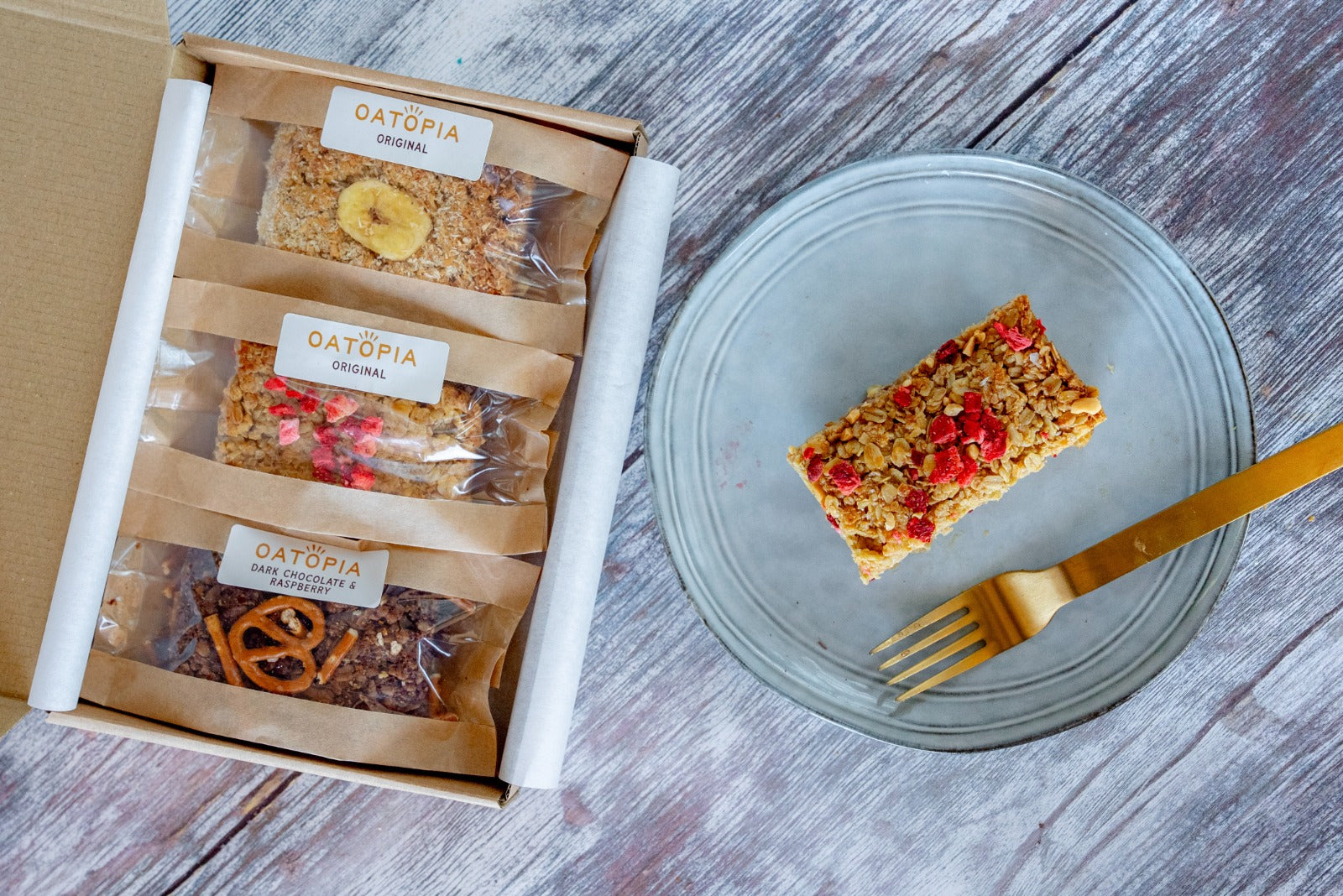  A box of Oatopia cake with a fork and knife beside it, ready for a delicious summer treat.