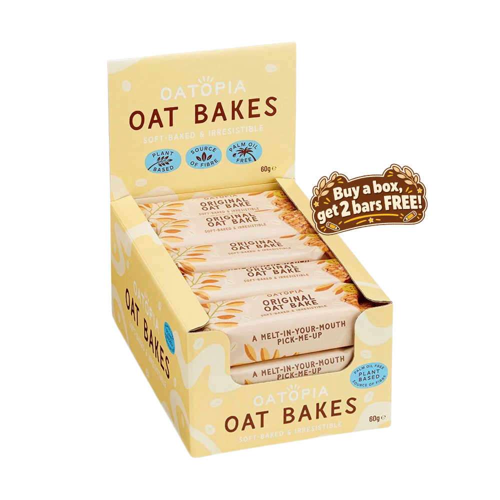 A box of Oatopia Oat Bakes soft baked treatable bars, shown open with several wrapped bars inside. The packaging is pale yellow with brown and blue text, and a brown promotional badge on the right says 'Buy a box, get 2 bars FREE!'.
